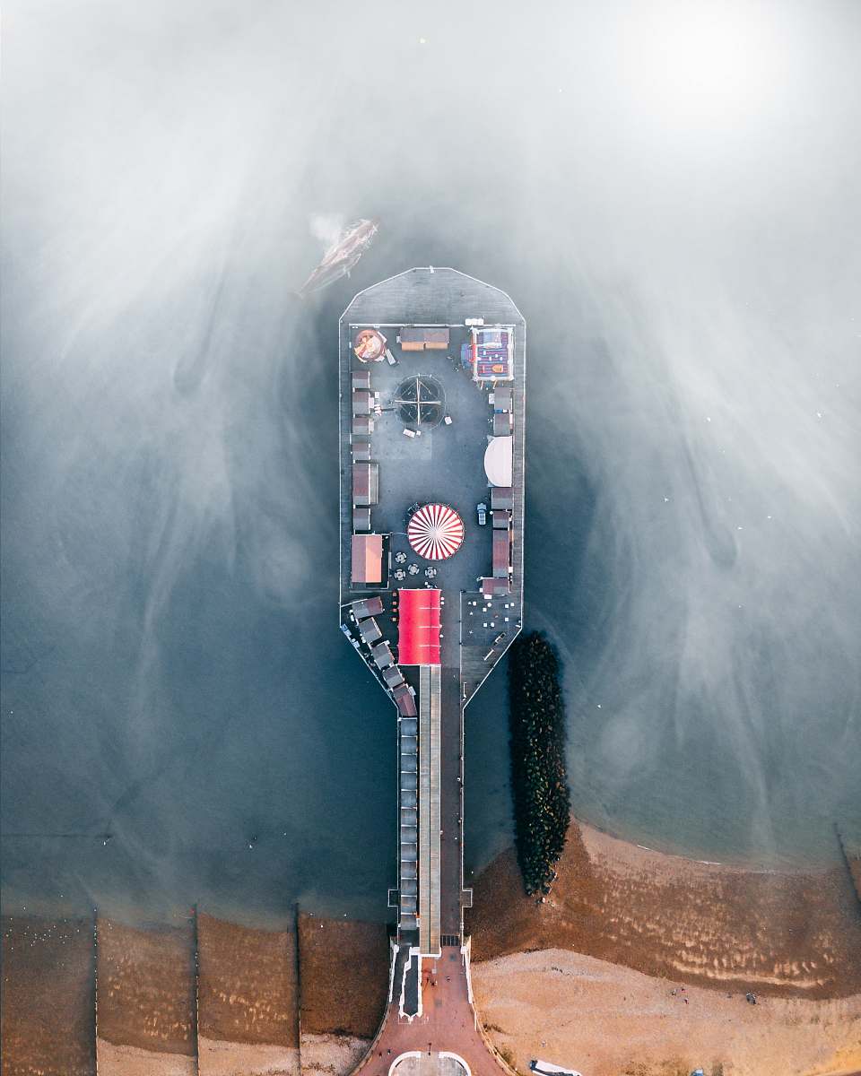 outdoors aerial photography of dock during goffy weather nature